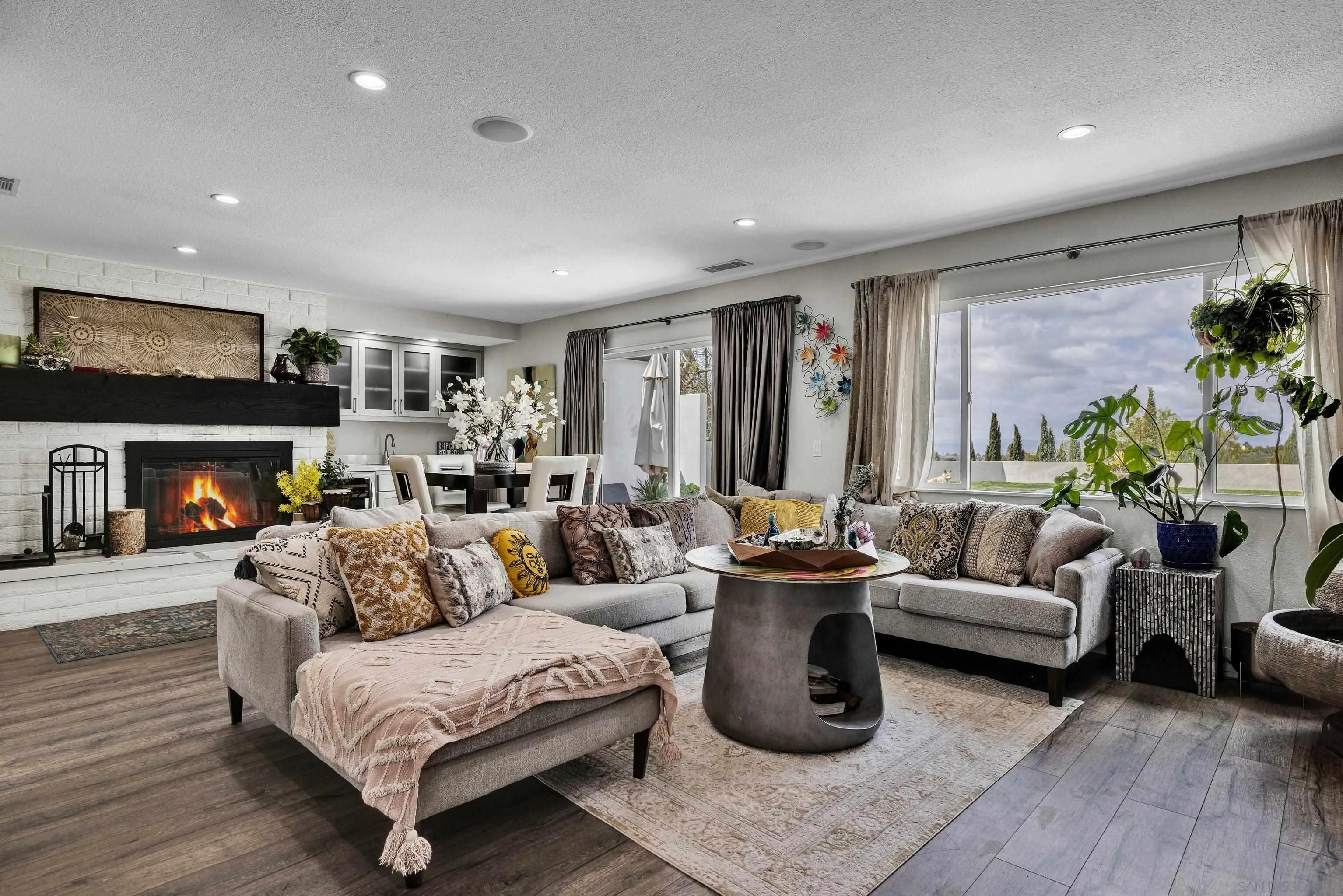 37389 Ave Chapala Temecula, CA 92592 - Photo 9 of 68 a living room with furniture fireplace and a large window