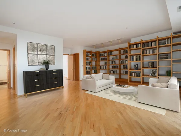 a spacious bedroom with a large bed and a couch