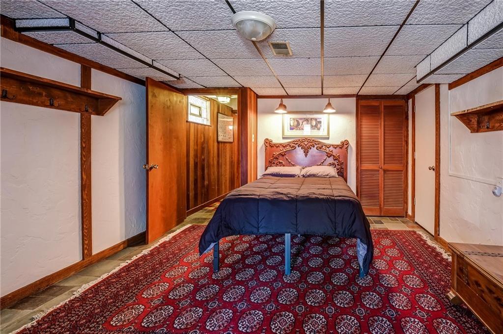 885 Black Road Volant, PA 16156 - Photo 17 of 24 a bed sitting in a bedroom next to a window