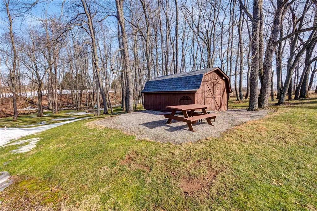 885 Black Road Volant, PA 16156 - Photo 24 of 24 a view of a swimming pool with a bench and trees