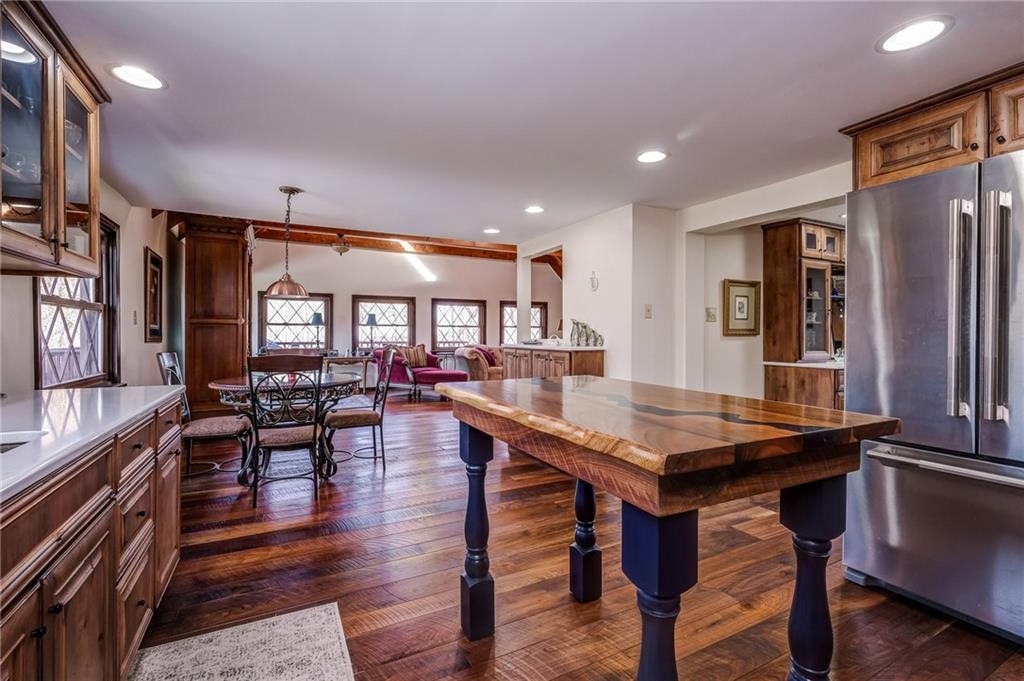 885 Black Road Volant, PA 16156 - Photo 7 of 24 a room with lots of wooden furniture wooden floor and a chandelier