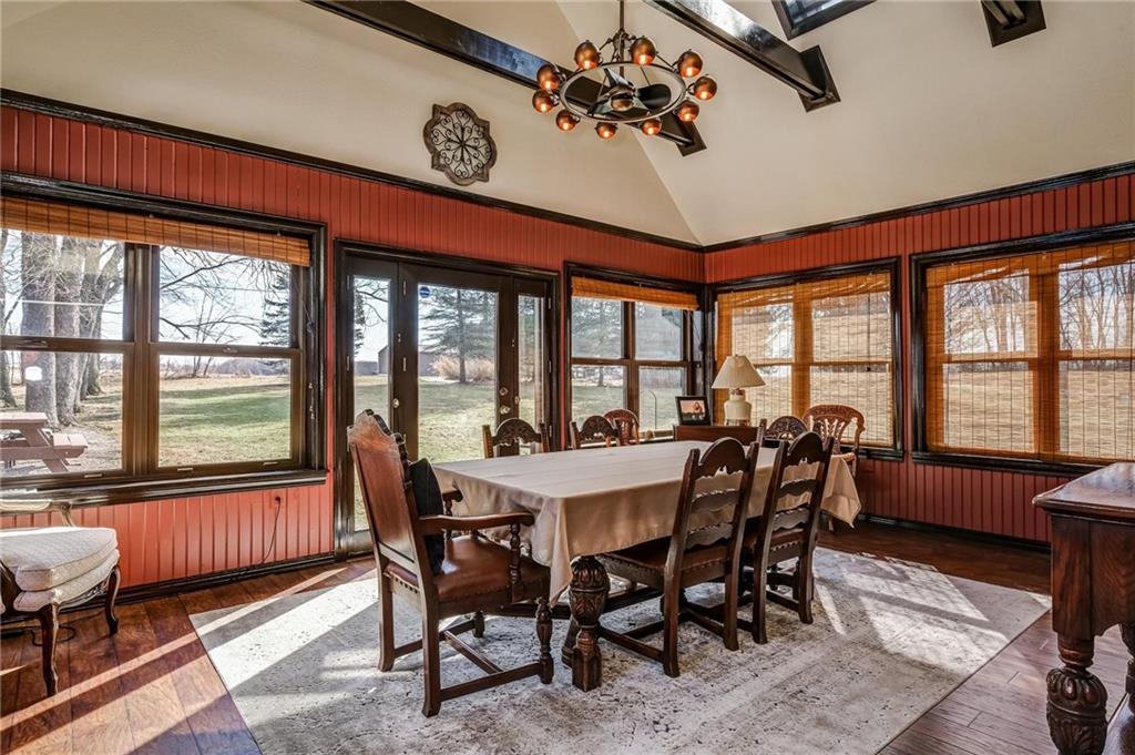 885 Black Road Volant, PA 16156 - Photo 9 of 24 a view of a dining room with furniture large windows and wooden floor