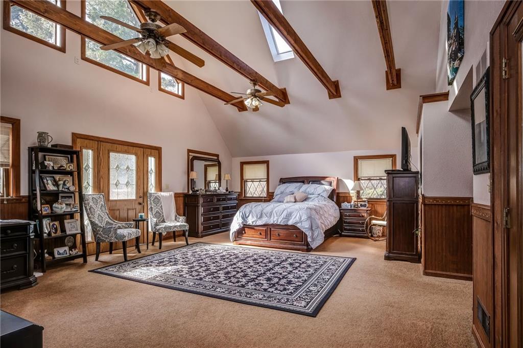 885 Black Road Volant, PA 16156 - Photo 10 of 24 a bedroom with furniture and a chandelier