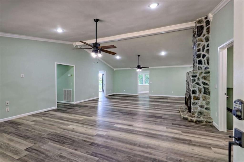 28 Coon Tail Road Blairsville, GA 30512 - Photo 26 of 100 a view of a room with a ceiling fan wooden floor and chandelier