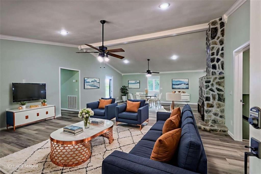 28 Coon Tail Road Blairsville, GA 30512 - Photo 27 of 100 a living room with furniture a flat screen tv and a window