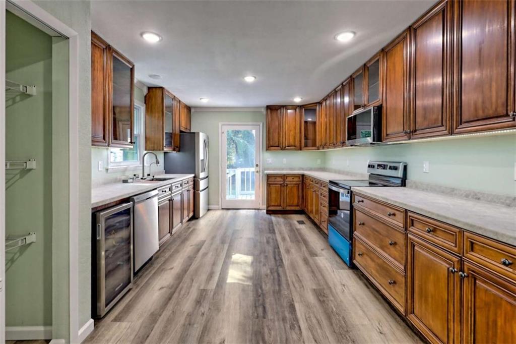 28 Coon Tail Road Blairsville, GA 30512 - Photo 34 of 100 a large kitchen with stainless steel appliances sink a stove and cabinets