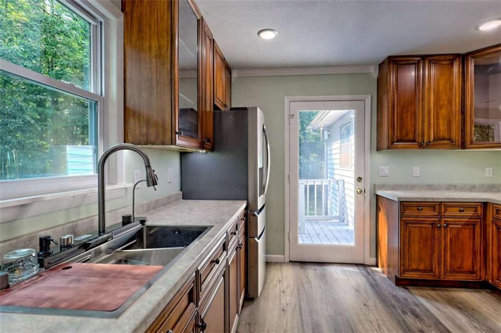 28 Coon Tail Road Blairsville, GA 30512 - Photo 35 of 100 a kitchen with granite countertop a stove a sink and a refrigerator