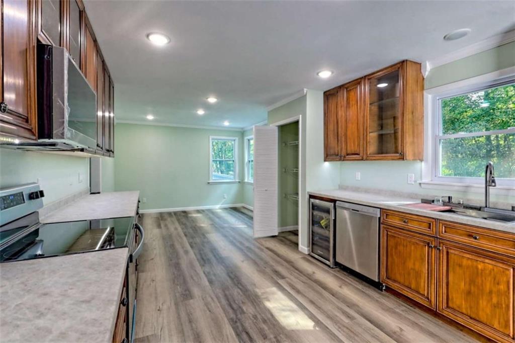 28 Coon Tail Road Blairsville, GA 30512 - Photo 40 of 100 a kitchen with a sink wooden floor and stainless steel appliances