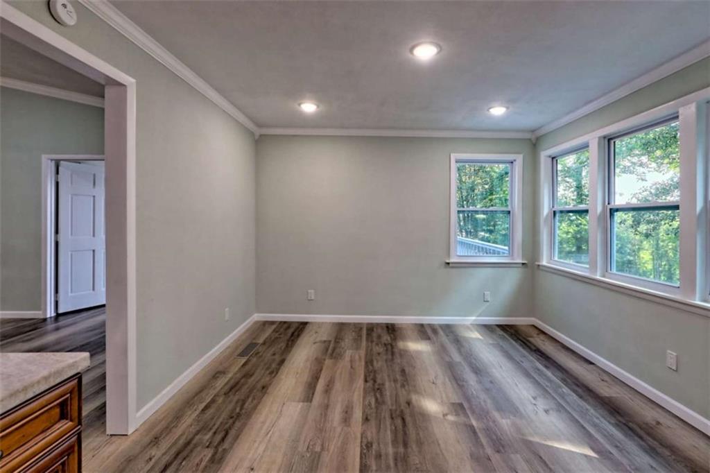28 Coon Tail Road Blairsville, GA 30512 - Photo 41 of 100 a view of empty room with wooden floor and fan