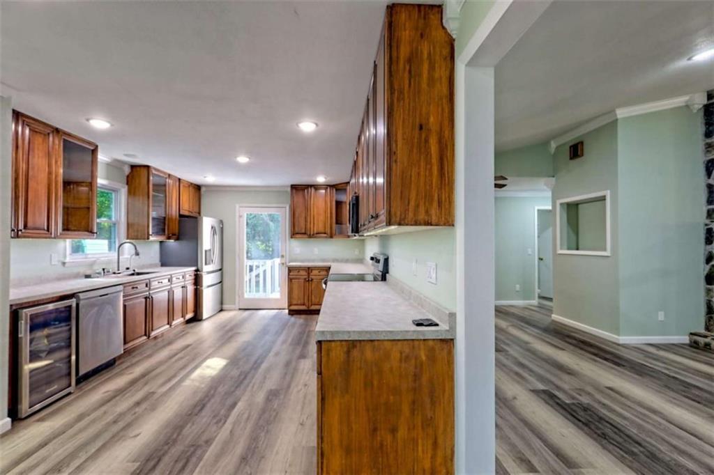 28 Coon Tail Road Blairsville, GA 30512 - Photo 43 of 100 a large kitchen with stainless steel appliances granite countertop a large counter top a stove and a refrigerator