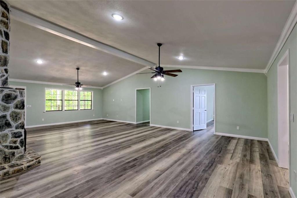 28 Coon Tail Road Blairsville, GA 30512 - Photo 46 of 100 a view of an empty room with window and wooden floor