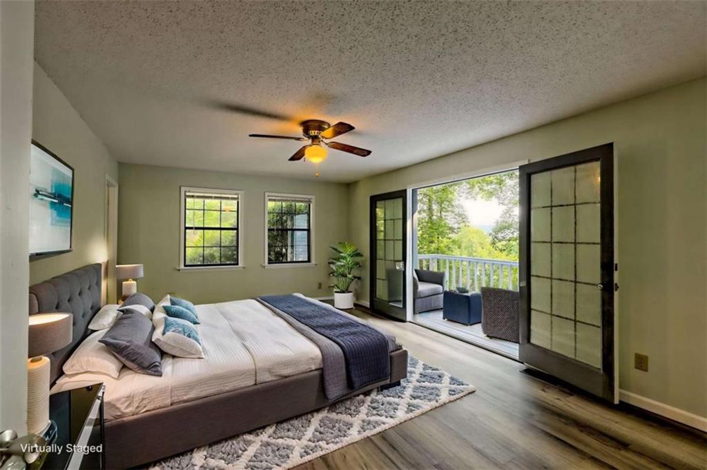 28 Coon Tail Road Blairsville, GA 30512 - Photo 49 of 100 a bedroom with a large bed and a window