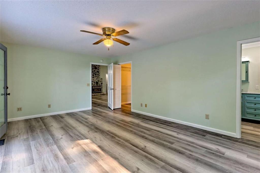 28 Coon Tail Road Blairsville, GA 30512 - Photo 60 of 100 a view of an empty room with wooden floor and a window