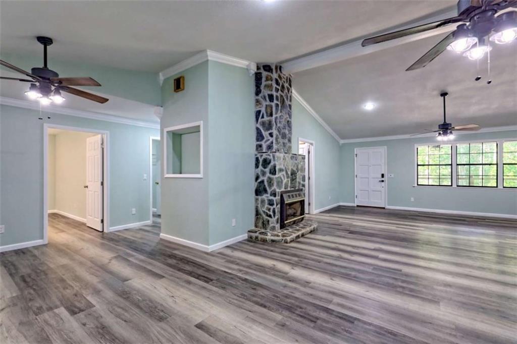 28 Coon Tail Road Blairsville, GA 30512 - Photo 70 of 100 a view of an empty room with window and wooden floor