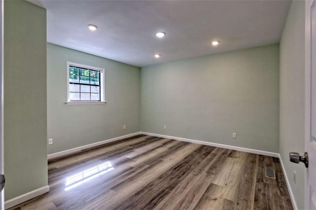 28 Coon Tail Road Blairsville, GA 30512 - Photo 71 of 100 a view of room with wooden floor and window