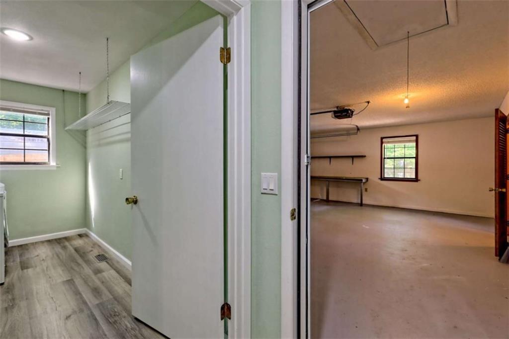 28 Coon Tail Road Blairsville, GA 30512 - Photo 73 of 100 a view of a hallway with wooden floor and a bathroom