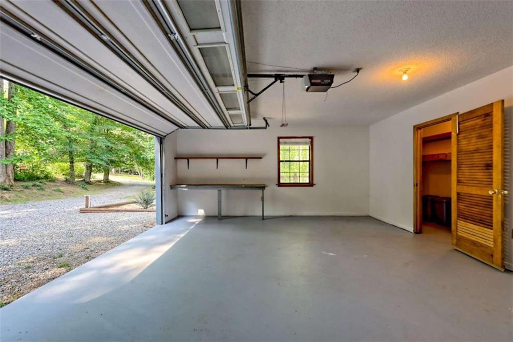28 Coon Tail Road Blairsville, GA 30512 - Photo 78 of 100 a view of an empty room with a fireplace and a window