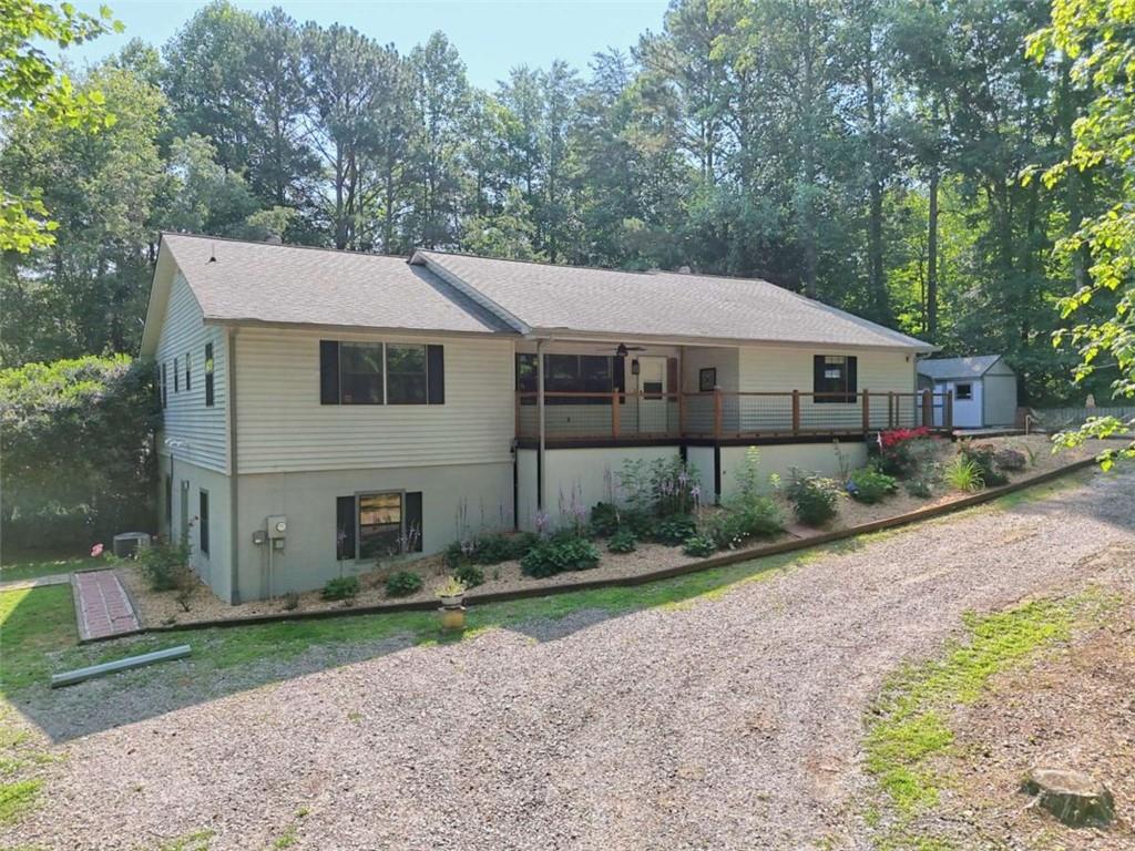 28 Coon Tail Road Blairsville, GA 30512 - Photo 8 of 100 a aerial view of a house next to a yard with big trees