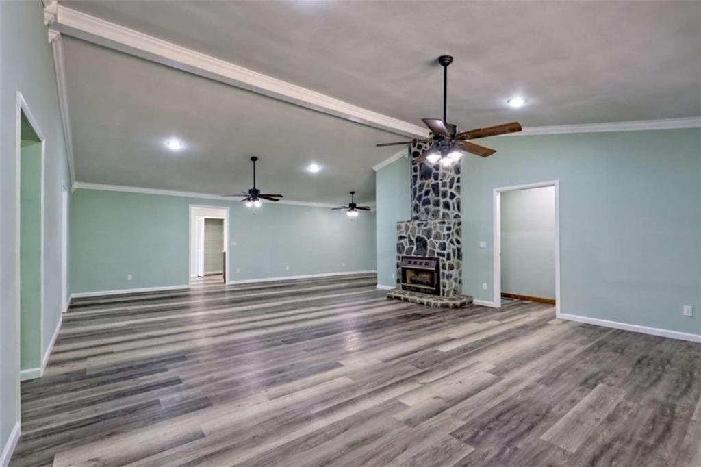 28 Coon Tail Road Blairsville, GA 30512 - Photo 82 of 100 a view of a livingroom with window wooden floor and a ceiling fan