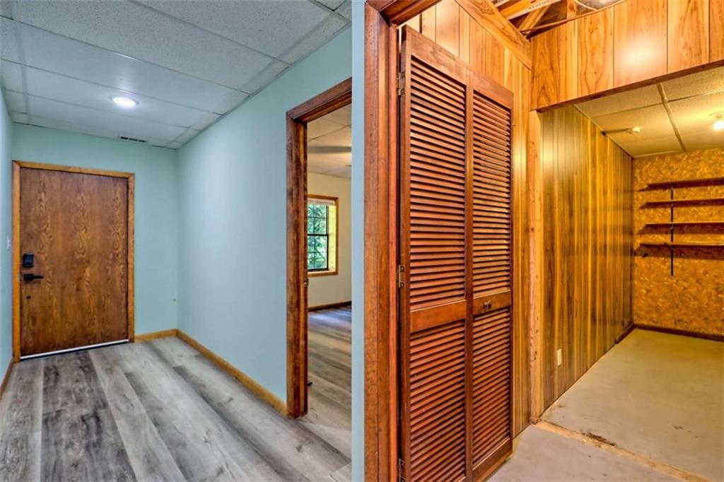 28 Coon Tail Road Blairsville, GA 30512 - Photo 91 of 100 a view of a hallway with wooden floor and staircase