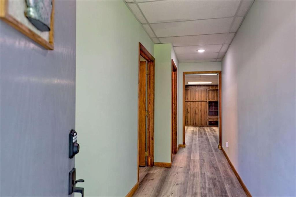 28 Coon Tail Road Blairsville, GA 30512 - Photo 96 of 100 a hallway with wooden floor closet and bathroom