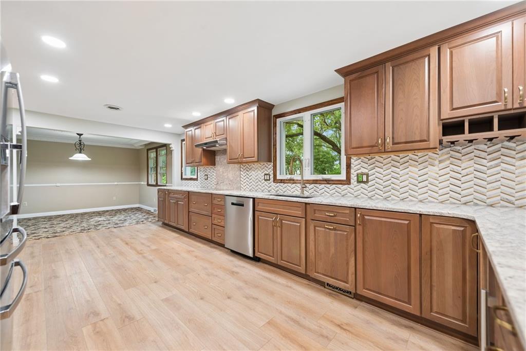 22 Buzzardtown Road Irwin, PA 15642 - Photo 6 of 44 a large bathroom with a granite countertop sink and a large mirror
