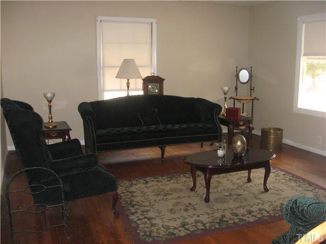 524 Dacian Road Raleigh, NC 27610 - Photo 5 of 5 a living room with furniture a rug and a window