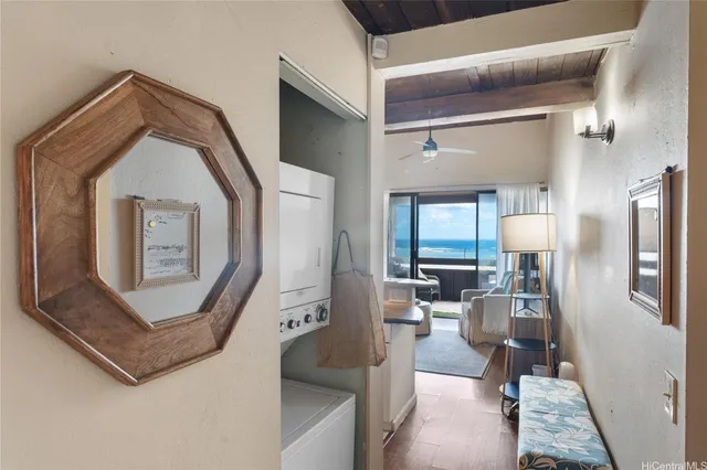a view of living room with furniture and a window