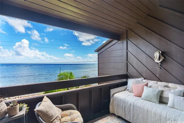 a view of a couches in the balcony