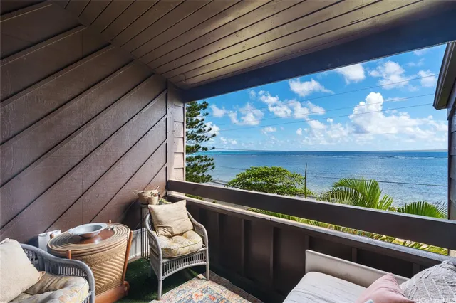 a view of a porch with furniture