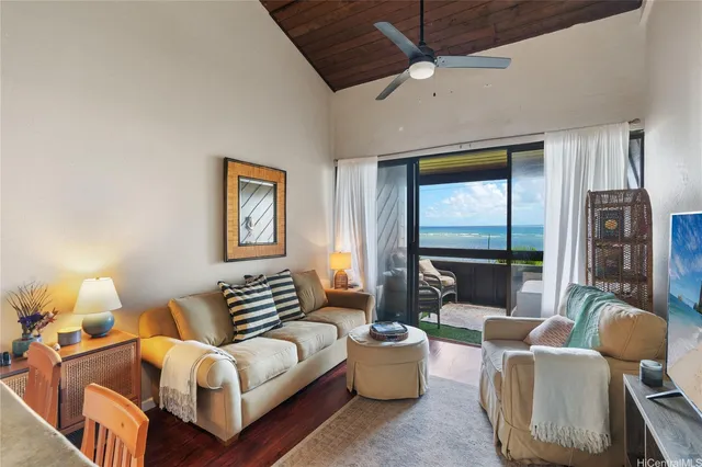 a spacious bedroom with furniture and a window