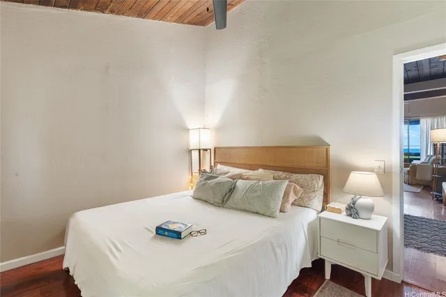 a bedroom with a bed and a table