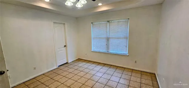 a view of an empty room and window