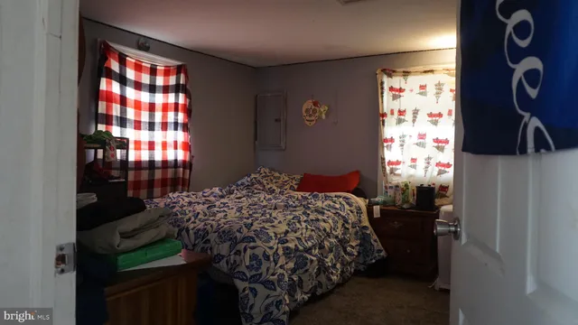 a bedroom with a bed and a closet