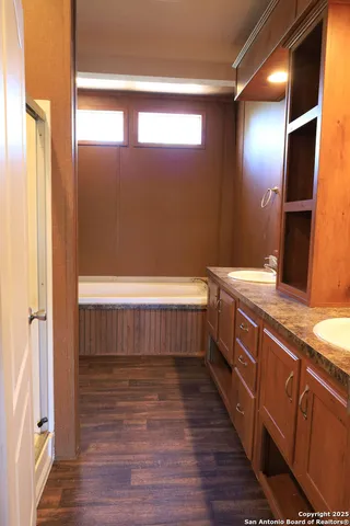 a bathroom with a bathtub and a sink