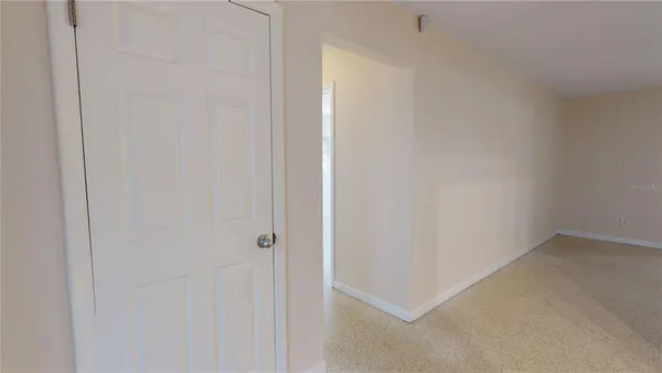 a view of empty room with ceiling fan