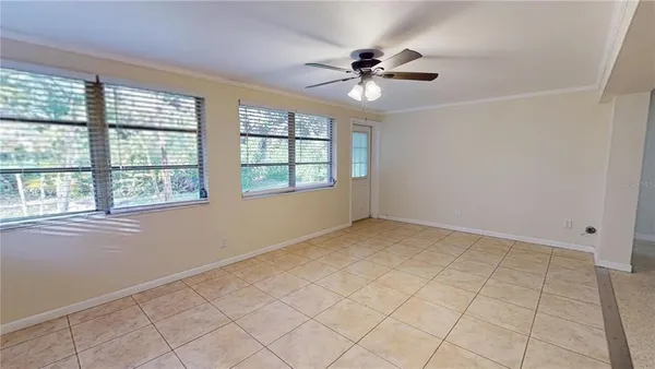 a view of an empty room with a window