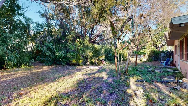 a backyard of a house with lots of green space