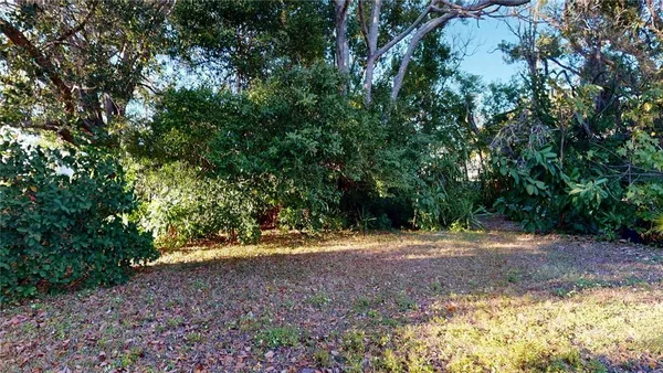 a view of water heater room with open space and mountain view