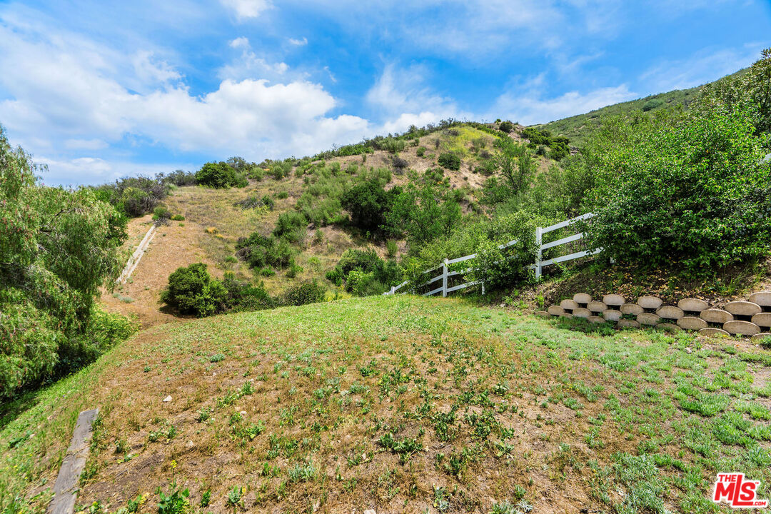 204 Bell Cyn Road Bell Canyon, CA 91307 - Photo 55 of 74 a view of a yard with plants and a bench