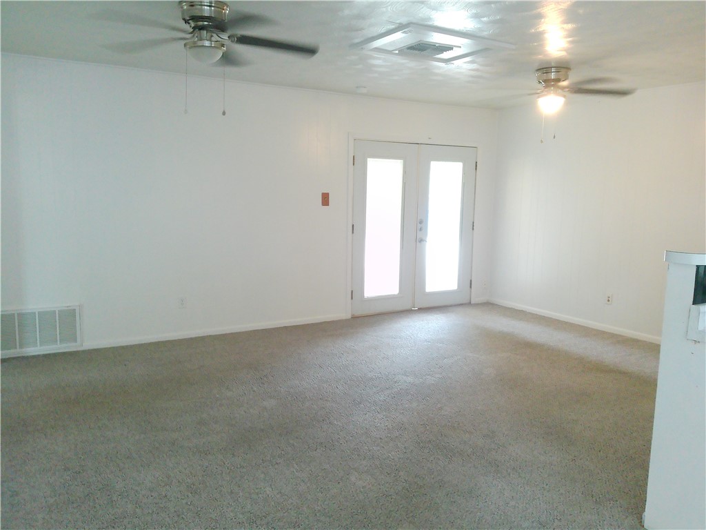 4117 Monaco Street Corpus Christi, TX 78411 - Photo 4 of 17 an empty room that has a window in it