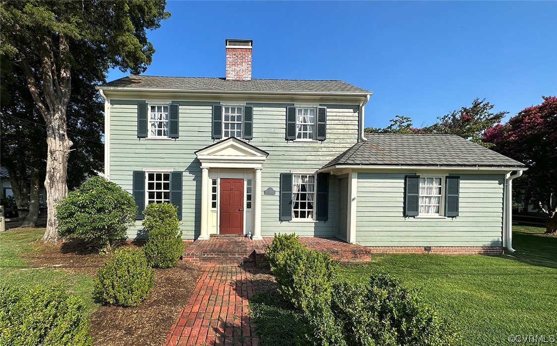 616 Main Street Reedville, VA 22539 - Photo 1 of 30 a front view of a house with a yard