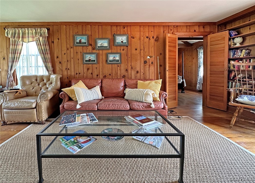 616 Main Street Reedville, VA 22539 - Photo 12 of 30 a living room with furniture a rug and a table