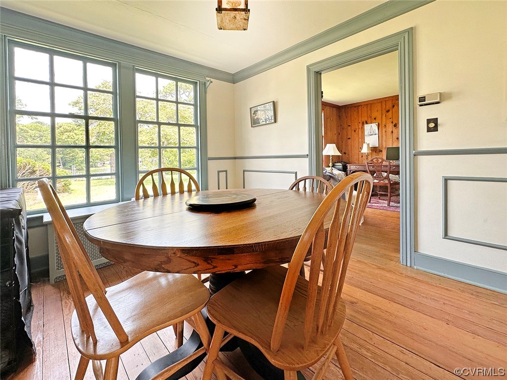 616 Main Street Reedville, VA 22539 - Photo 15 of 30 a view of a dining room with furniture window and wooden floor