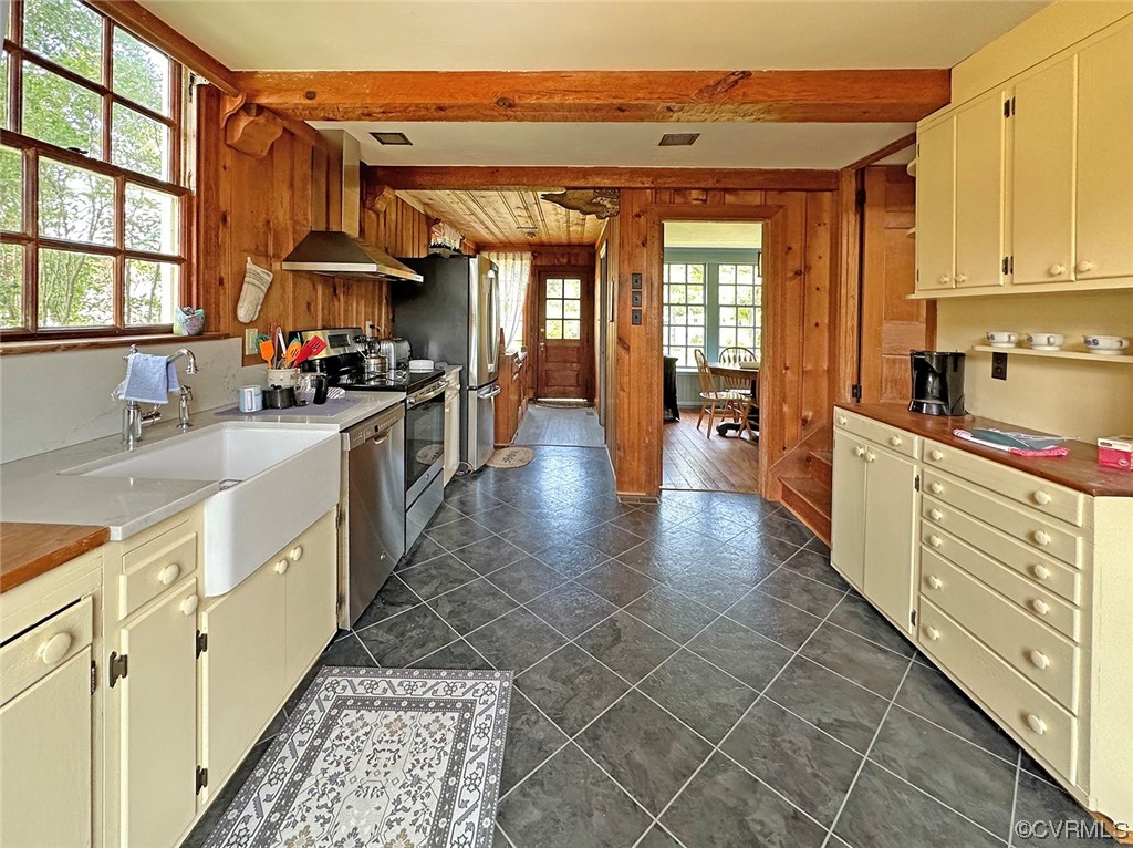 616 Main Street Reedville, VA 22539 - Photo 18 of 30 a large kitchen with stainless steel appliances granite countertop a lot of counter space and a window