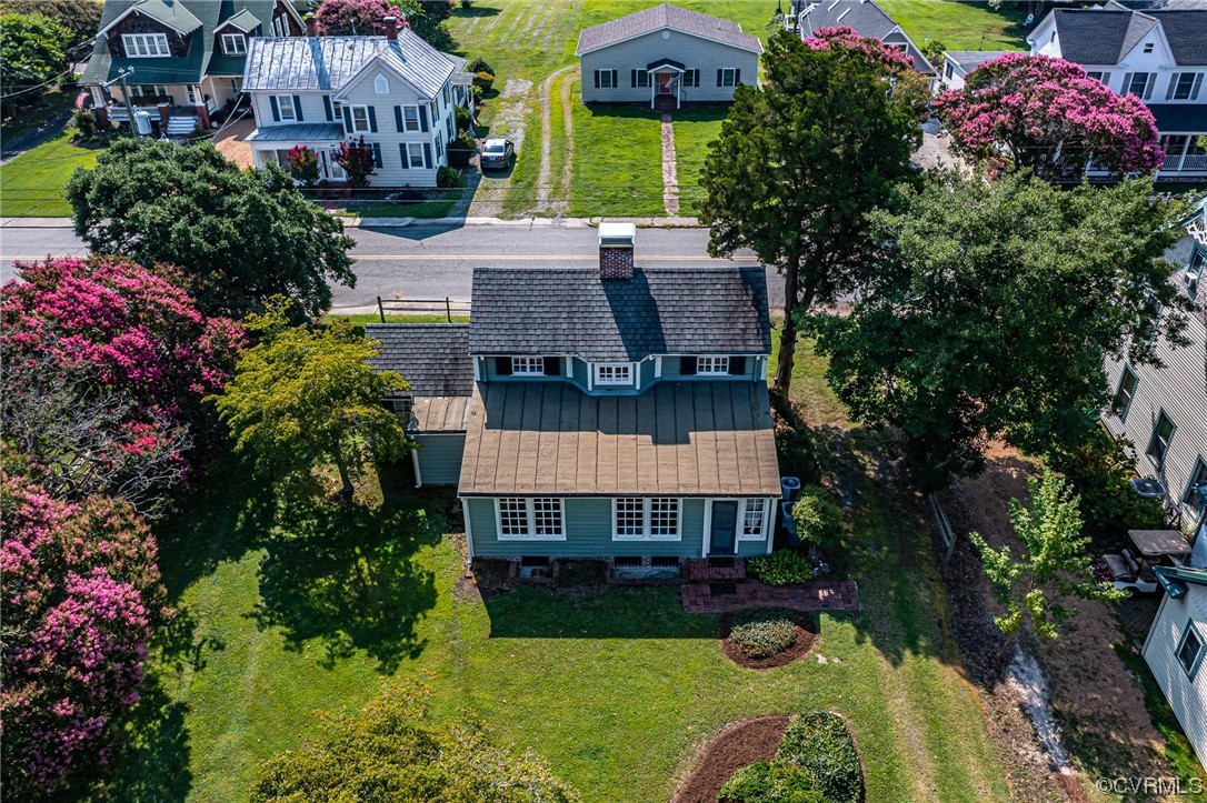 616 Main Street Reedville, VA 22539 - Photo 28 of 30 a aerial view of a house with garden space and a street view