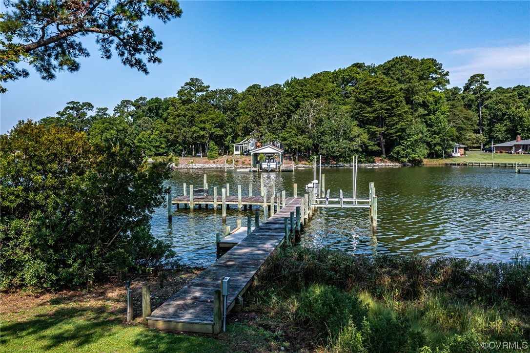 616 Main Street Reedville, VA 22539 - Photo 9 of 30 a view of a lake with a house in the background