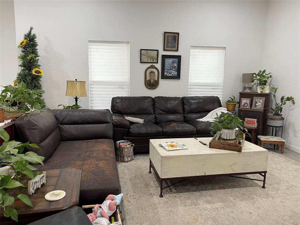200 Austin Street Rice, TX 75155 - Photo 13 of 22 a living room with furniture and a potted plant