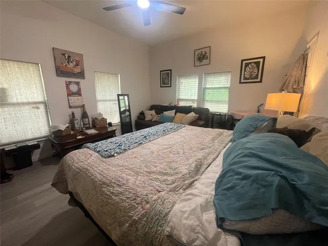 a bedroom with a bed and window