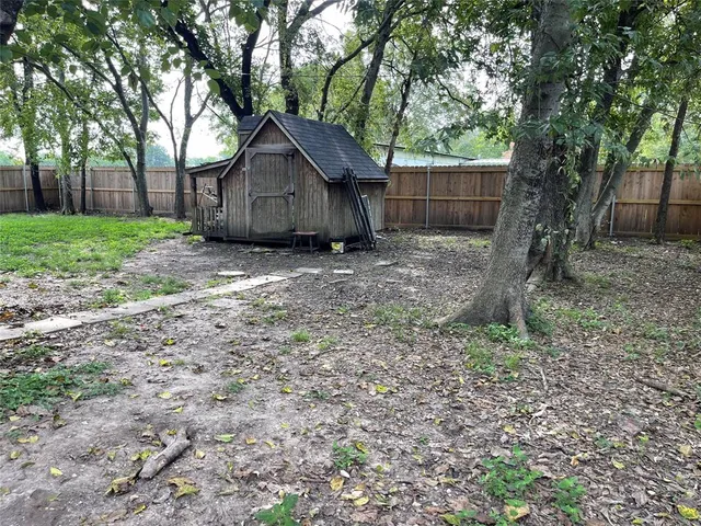 a house view with a backyard space